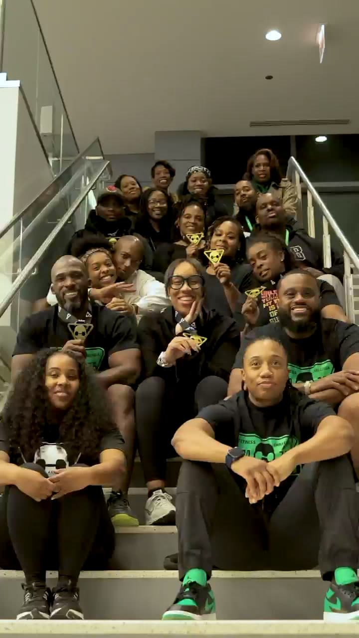 Blackout Fit competitors gathered on the steps with their medals after the inaugural event, November 2025